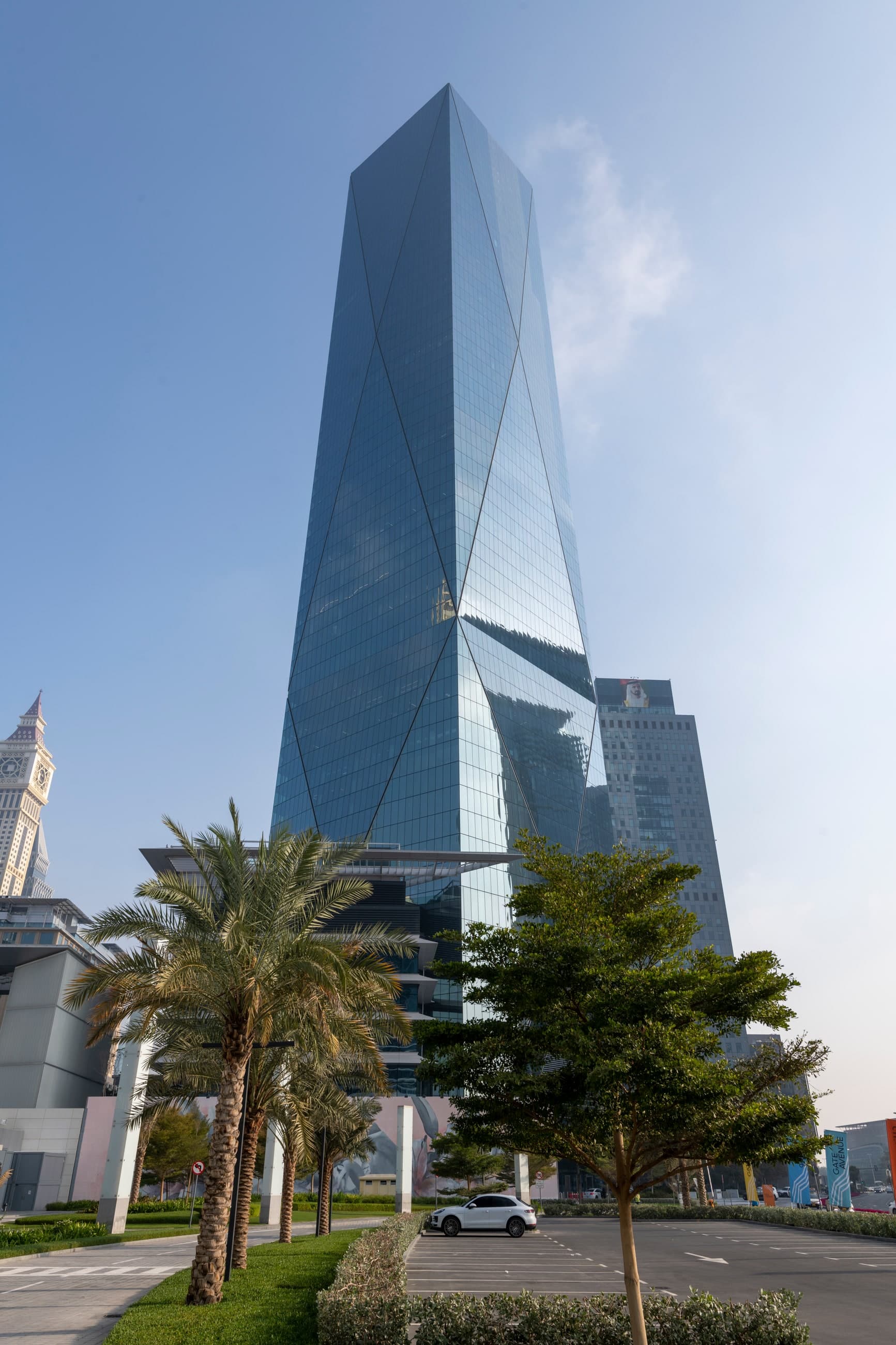 ICD Brookfield Place in DIFC, its faceted glass tower rising above palms.